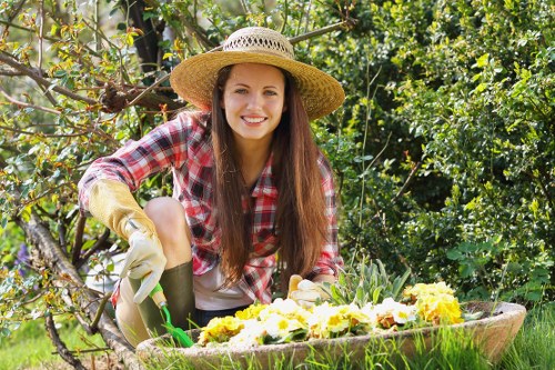 Local gardeners trimming hedges in Mile End